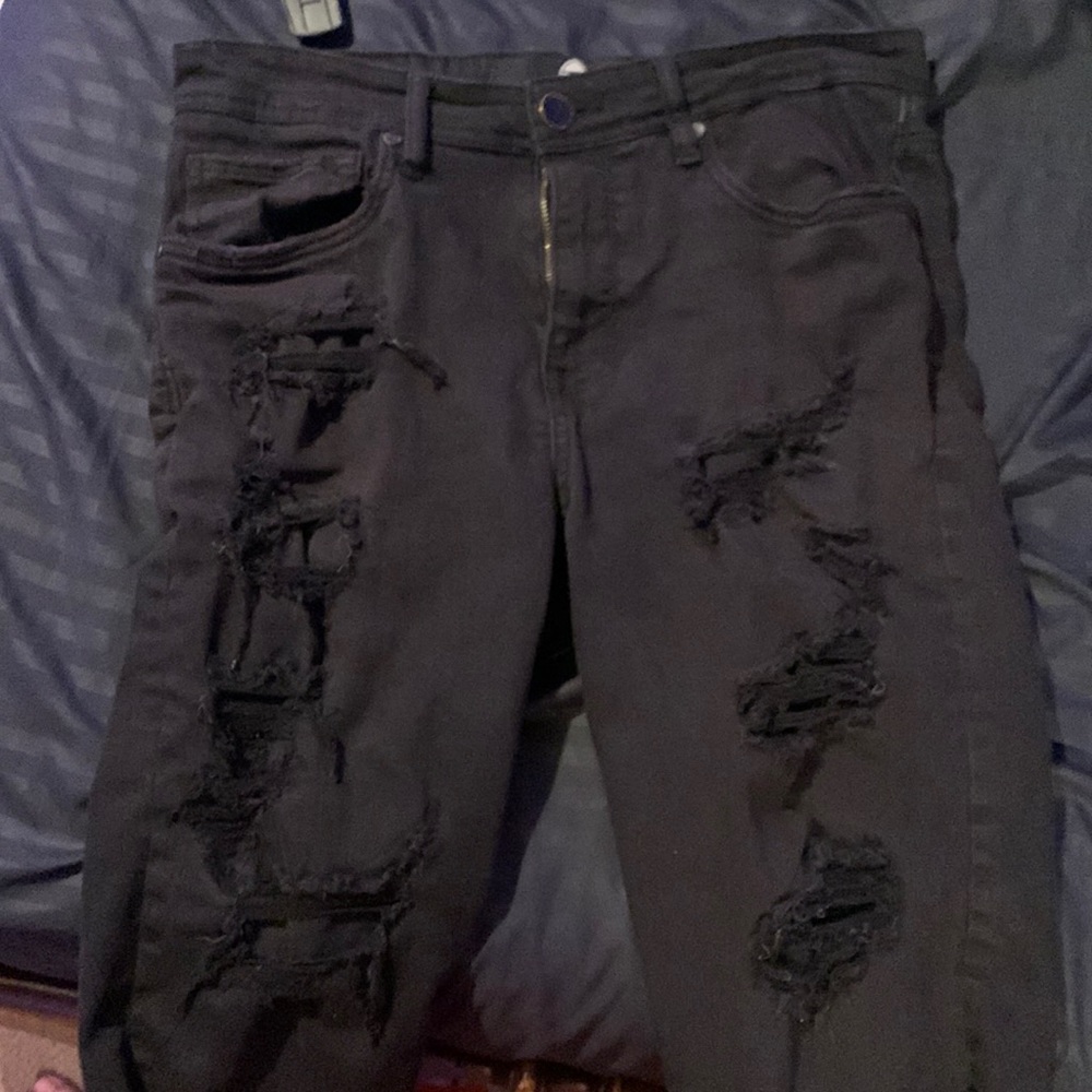 All black ripped jean shorts.